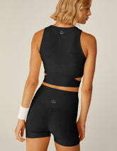 black high-neck cropped tank with wrap front with side cutouts.